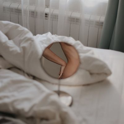 Minimalist interior with a plant, suggesting a peaceful space for practice.